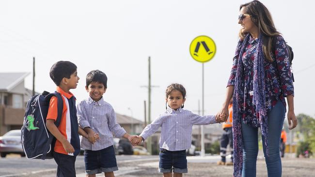 Students are dropped off on the first day at the North Kellyville Public School. Picture: Dylan Robinson