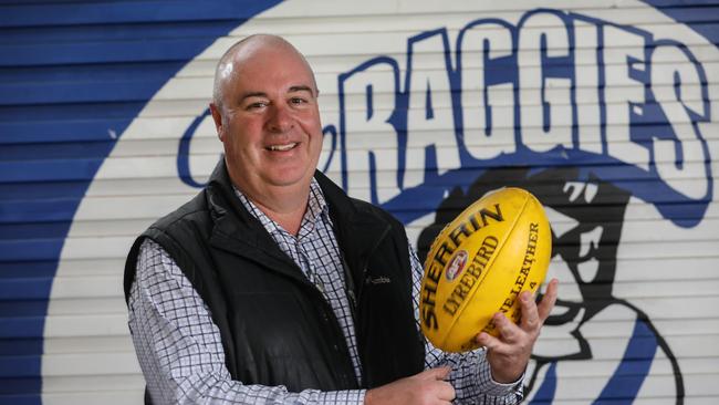 Athelstone president Stephen Young in front of a Raggies logo. Picture: AAP/Russell Millard