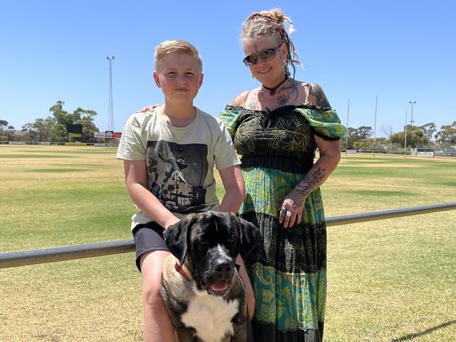 Gypsy Peace and Buddy Snewin, with dog Humphry, are thankful for the support at the Mannum emergency relief centre. Photo: Dylan Hogarth