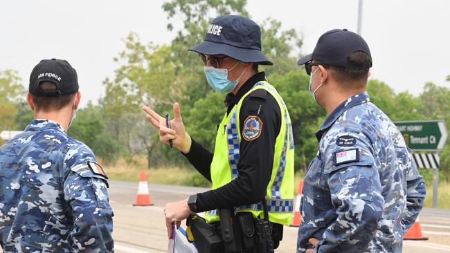 ADF staff assist NT Police at the southern border control point in Katherine. Picture: Amanda Parkinson