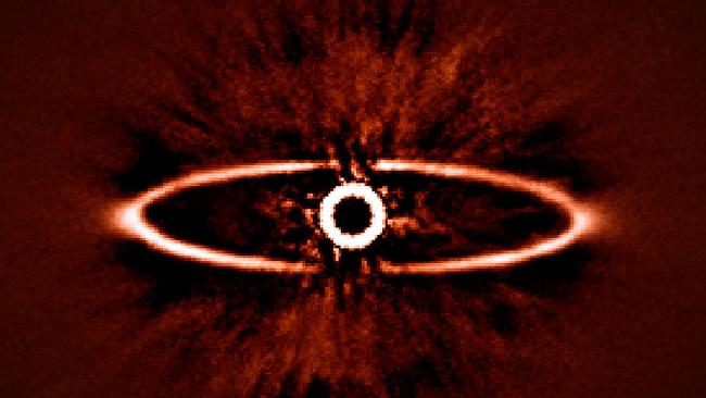 This infrared image shows the dust ring around the nearby star HR 4796A in the southern constellation of Centaurus. It was one of the first produced by the SPHERE instrument soon after it was installed on ESO’s Very Large Telescope in May 2014. It shows not only the ring itself with great clarity, but also reveals the power of SPHERE to reduce the glare from the very bright star — the key to finding and studying exoplanets in future.