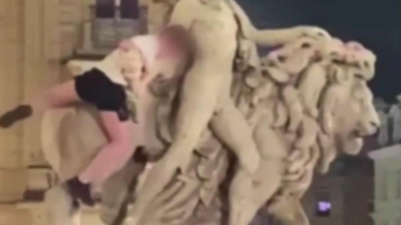 A tourist was filmed sitting on the statue at the Brussels Stock Exchange in Belgium before he climbed off and broke it.