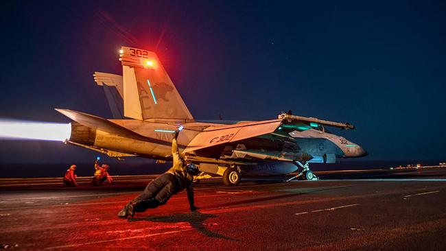 A US fighter plane lauches from the deck of the aircraft carrier USS Eisenhower in the Red Sea during operations against Houthi targets. Picture: CentCom via AFP.