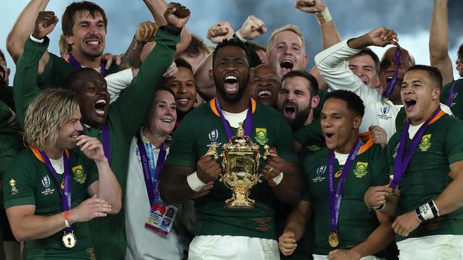 YOKOHAMA, JAPAN - NOVEMBER 02:  Siya Kolisi, the South Africa captain, raises the Webb Ellis Cup after their victory during the Rugby World Cup 2019 Final between England and South Africa at International Stadium Yokohama on November 02, 2019 in Yokohama, Kanagawa, Japan. (Photo by David Rogers/Getty Images)