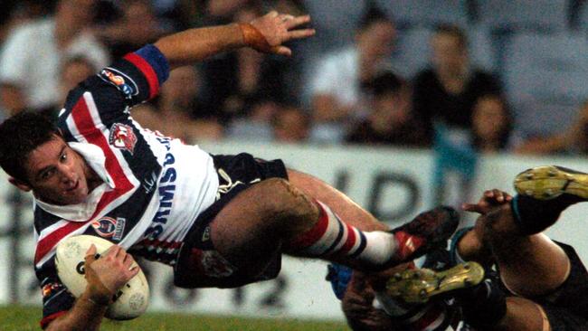Brad Fittler in full flight for the Roosters against the Panthers in 2004.