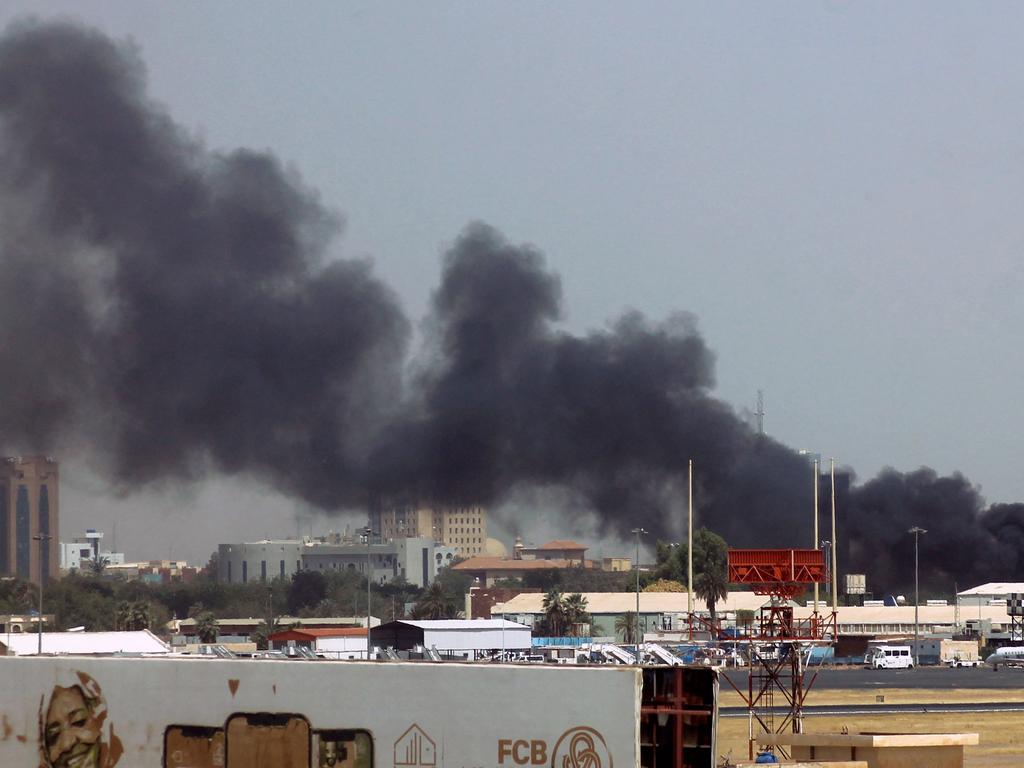 Heavy smoke bellows above buildings in the vicinity of the Khartoum airport on April 15, 2023, amid clashes in the Sudanese capital. Picture: AFP