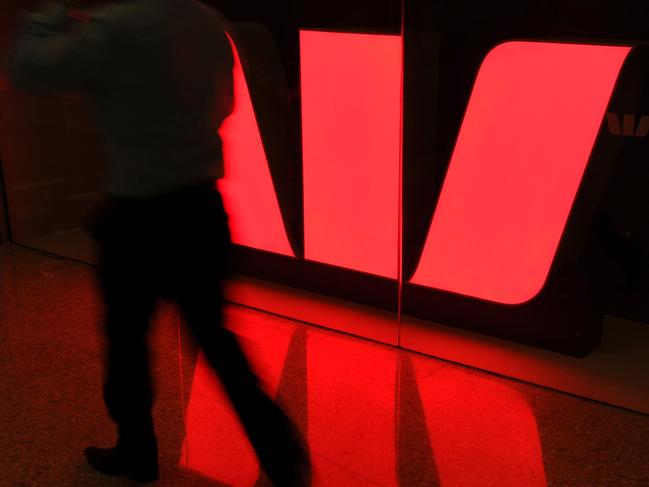 The Westpac Bank logo is reflected on the floor of a shopping centre in Sydney, 28/07/2011.