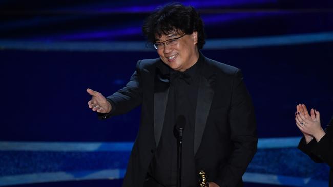 South Korean film director Bong Joon-ho accepts the Acadamy Award for best director for Parasite. The movie also won the best picture Oscar, the first foreign language film to do so. Picture: AFP