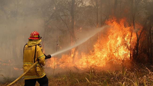 A firefighter works to contain a bushfire in NSW. (AAP Image/Darren Pateman)