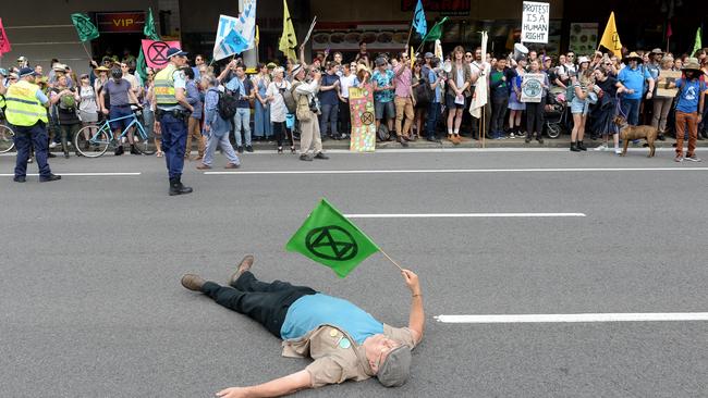 A protester lays on the ground. Picture: AAP