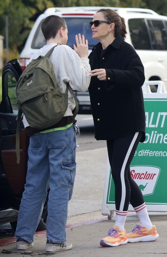 The actress waits with her daughter for the school bus in LA. Picture: Backgrid