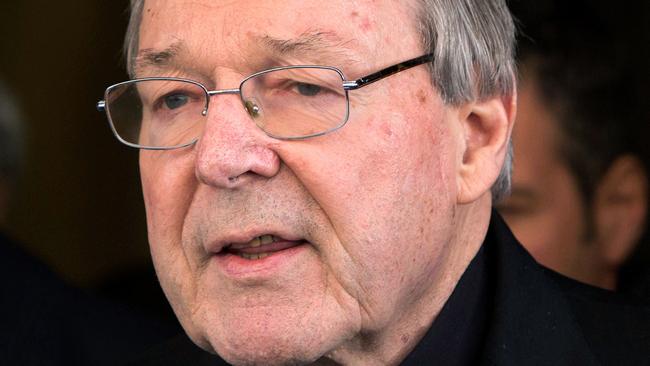 FILE - In this March 3, 2016, file photo, Australian cardinal George Pell reads a statement to reporters as he leaves the Quirinale hotel after meeting members of the Australian group of relatives and victims of priestly sex abuses, in Rome, Italy. A lawyer for the most senior Vatican official ever charged in the Catholic Church sex abuse crisis told an Australian court on Tuesday, April 17, 2018 that Pell could have been targeted with false accusations to punish him for the crimes of other clerics. (AP Photo/Riccardo De Luca, File)