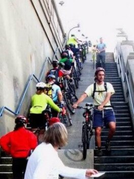 Peak hour for cyclists involve carrying bikes up and down the bridge.