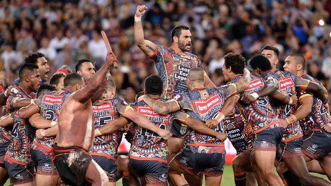 Greg Inglis and the Indigenous All Stars perform a war dance before kick-off at Suncorp Stadium.