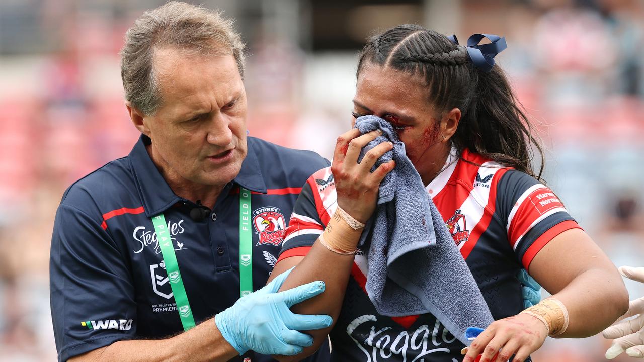 Taylor-Adeline Mapusua of the Roosters is assisted off the field by doctor Nathan Gibbs. Picture: Getty Images