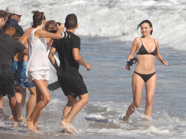 Kerr runs through the Malibu surf for the photoshoot.