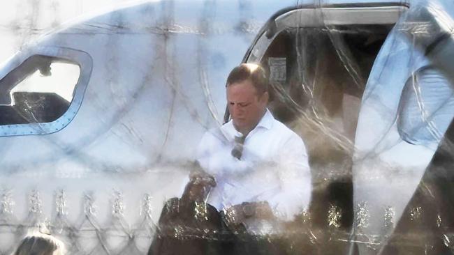 Premier Steven Miles and staff exit a private jet. Pic: Lyndon Mechielsen.