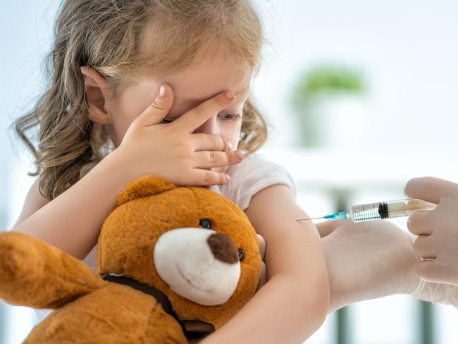 A doctor making a vaccination to a child istock image