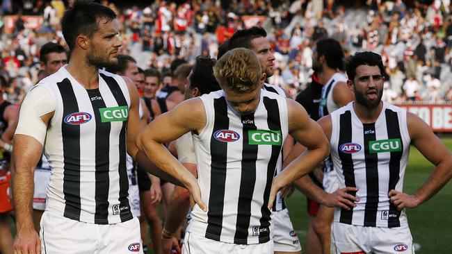 AFL: Round 3 St Kilda v Collingwood Nathan Brown Adam Treloar & Alex Fasolo after the siren Picture:Wayne Ludbey