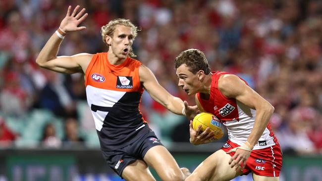 Nick Haynes puts the pressure on Sydney’s Will Hayward. Picture: Getty Images