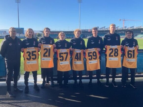 Coach Josh Moore with the Rays’ seven debutants: Finn Jakstas, Harrison Jones, Nick Collier, Taj Campbell-Farrell, Chris Buttner, Hudsyn Hill and Spencer Robertson.