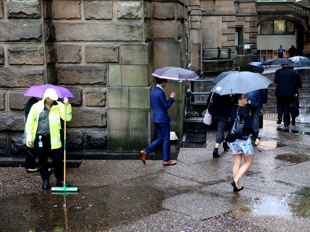 As The low hits Sydney people around town hall .picture John Grainger