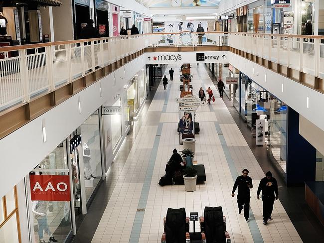 WATERBURY, CT - MARCH 28: People walk through a nearly empty shopping mall on March 28, 2017 in Waterbury, Connecticut. As consumers buying habits change and more people prefer to spend money on technology and experiences like vacations over apparel, shopping malls across the country are suffering.In the last decade dozens of malls have closed as retailers like JCPenney, Macy's and Sears, known as 'anchor stores,' close hundreds of locations do to falling sales. Real estate firm CoStar are projecting that nearly 25% of American malls are in danger of losing their anchors stores.   Spencer Platt/Getty Images/AFP == FOR NEWSPAPERS, INTERNET, TELCOS & TELEVISION USE ONLY ==