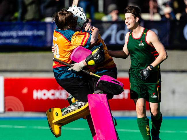 Goalkeepers Jack and Henry Larkin celebrate after Tasmania won the U18 hockey final. Picture: Linda Higginson