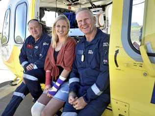 REUNION: Catching up at the Toowoomba LifeFlight base yesterday are (from left) Anthony Connolly, Tiffany Thompson - who was helped by LifeFlight last month - and Dave Hampshire. Picture: Bev Lacey