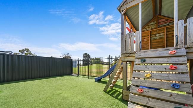 The home’s cubby house with golf course in the background. Supplied