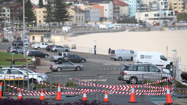 Signs and tape block entrances to the Bondi Beach car park. Picture: Damian Shaw