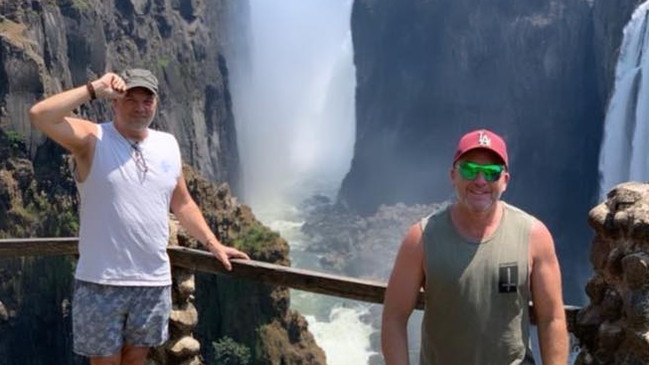 Aaron Coshaw with his partner Jay Horne. The pair was on a trip when Mr Coshaw collapsed and died at Victoria Falls in Zambia. Picture: Facebook.