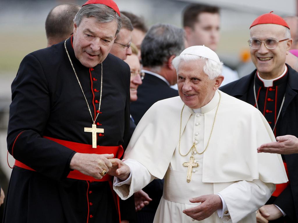 Pope Benedict XVI, right, is greeted by Cardinal George Pell, left, upon his arrival in Sydney, in 2008. Picture: AP