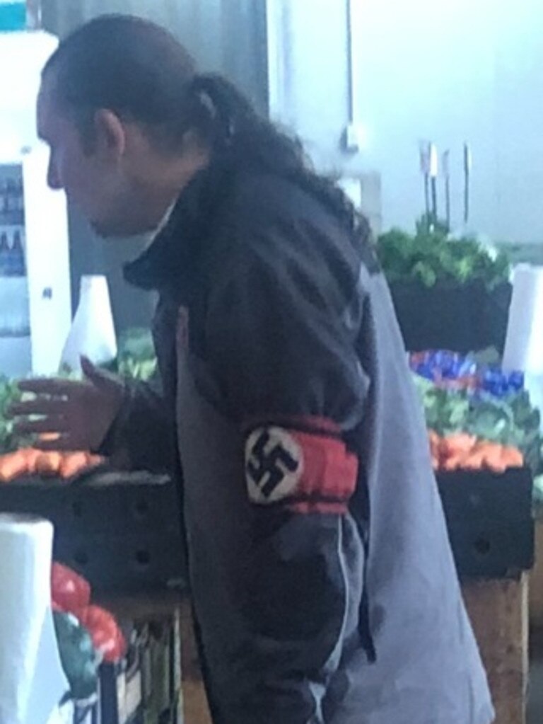 Man wearing a Nazi swastika armband shocks shoppers at a local Melbourne market in February 2021. Picture: Supplied