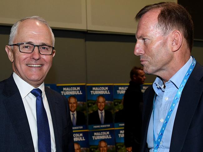 Prime Minister Malcolm Turnbull and former prime minister Tony Abbott speak during the NSW Liberal Party Futures convention, at Rosehill Racecourse, in Sydney, Saturday, July 22, 2017. (AAP Image/Dan Himbrechts) NO ARCHIVING