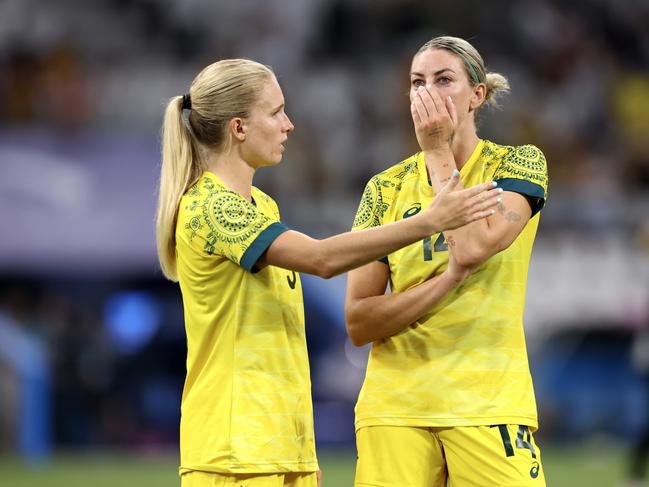 Kaitlyn Torpey and Alanna Kennedy look dejected after the loss which ended their Olympics campaign. Picture: Getty Images