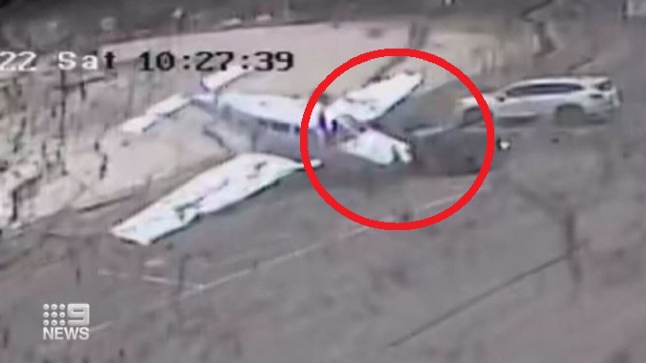 CCTV captured the dramatic moment a light plane crashed into a parked car in Sydney’s west. Picture: 9 News