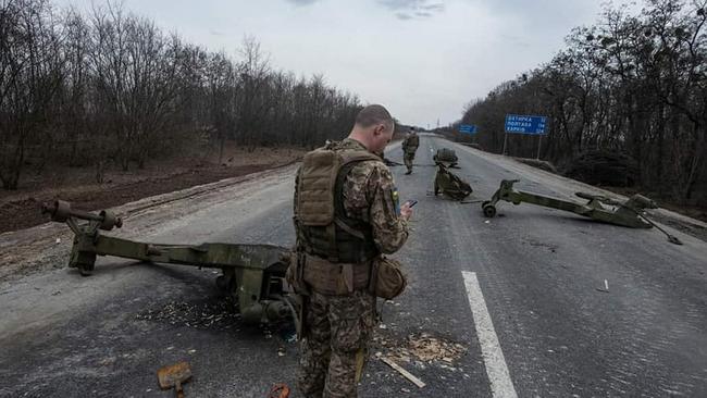 Ukrainian soldiers walking among destroyed Russian military equipment following a battle in the town of Trostyanets, Sumy region. Picture: General Staff of the Armed Forces of Ukraine/AFP