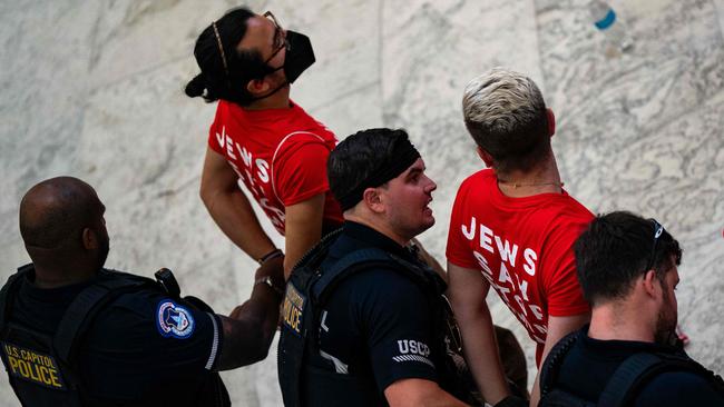 Jewish Voice For Peace protesters are taken into custody as they demonstrate in the Cannon House Office Building. Picture: AFP