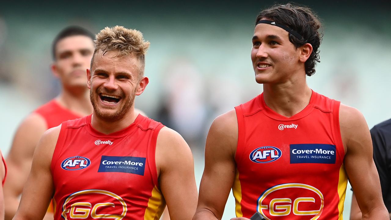 MELBOURNE, AUSTRALIA - MAY 01: Brandon Ellis and Will Powell of the Suns enjoy winning the round seven AFL match between the Collingwood Magpies and the Gold Coast Suns at Melbourne Cricket Ground on May 01, 2021 in Melbourne, Australia. (Photo by Quinn Rooney/Getty Images)