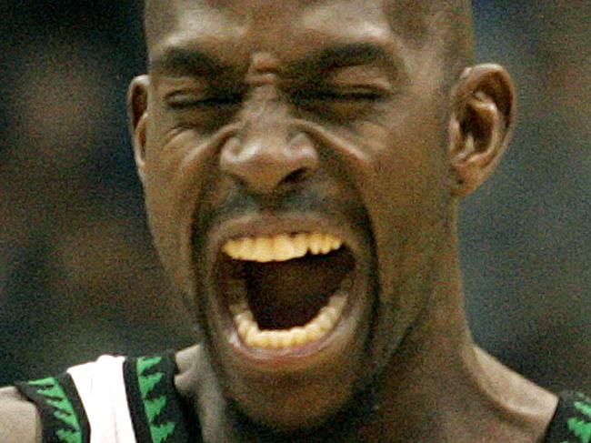 FILE - In this Nov. 25, 2006, file photo, Minnesota Timberwolves forward Kevin Garnett pumps his fist to his chest before the start of the basketball game against the Los Angeles Clippers in Minneapolis. Garnett is coming back to the place it all began. A person with knowledge of the deal says the Minnesota Timberwolves are sending forward Thaddeus Young to the Brooklyn Nets for Garnett. The person spoke Thursday, Feb. 19, 2015, on condition of anonymity because the deal had not been officially announced. (AP Photo/Andy King, File)