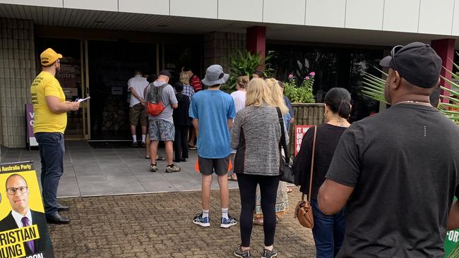 Voters line up at the Mercury House booth in Mackay on the first day of early voting for the 2022 federal election. Picture: Duncan Evans