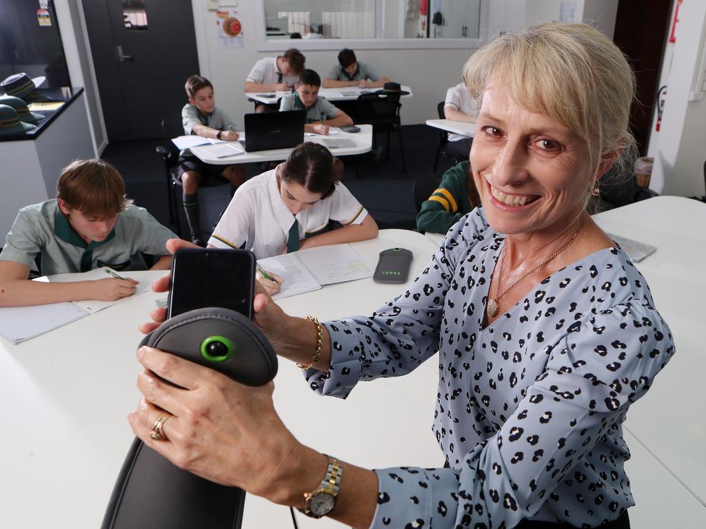 Principal Helen Jamieson with the YONDR phone locking pouch that’s been successfully rolled out at Corinda State High School. Picture: Liam Kidston