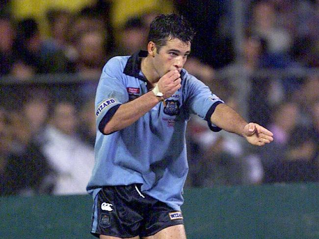 Ryan Girdler signals a try.