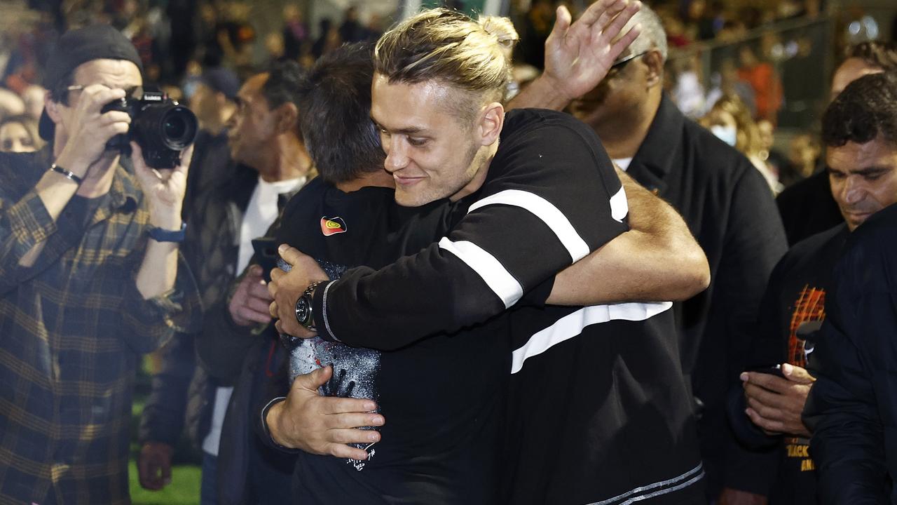 Darcy Moore embraces Nicky Winmar during Ngarra Jarra Noun Healing Ceremony at Victoria Park. Picture: Getty Images