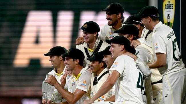 The Australian cricket team celebrating winning the Ashes series in Hobart. Picture: Steve Bell/Getty Images