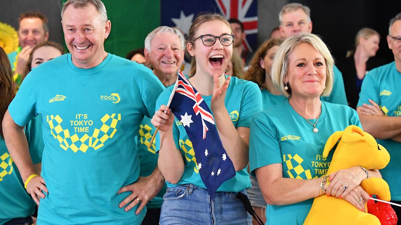 Ariarne Titmus’ parents Steve and Robyn with daughter Mia watching her win the 400m freestyle on Monday. Picture Patrick Woods.