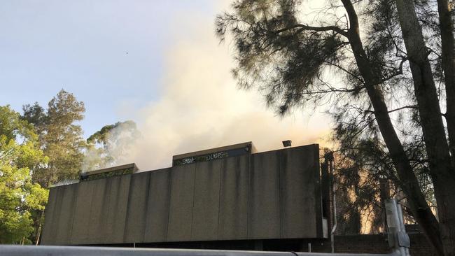 Smoke billow from the abandoned library building. Picture: Facebook