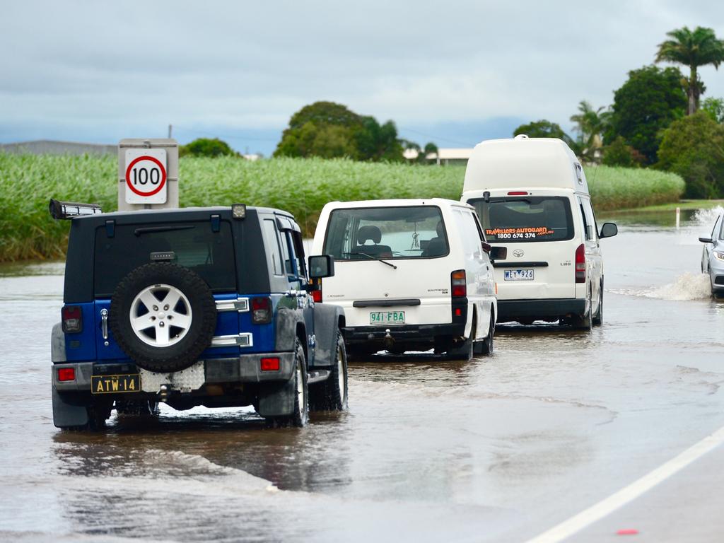 Cars passing through water just north of Ayr. Picture: Scott Radford-Chisholm