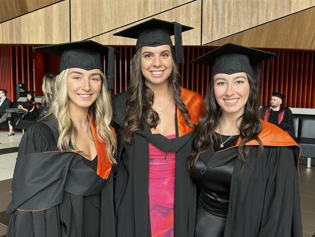 Monica Fernandez and Teena Getulio graduate with a Bachelor of Exercise and Sport Science while Jorjia-Rose Prodromidis graduates with a Bachelor of High Performance from the Australian Catholic University on April 17, 2024. Picture: Brittany Busch